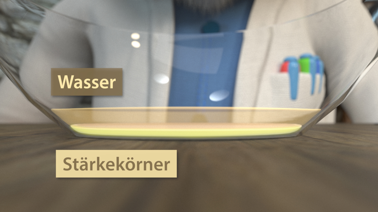 Eine Schüssel mit Wasser und darunter Stärke-Körner, die sichtbar sind.