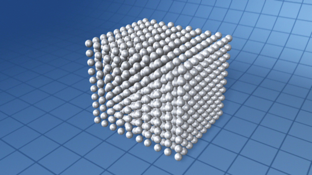 3D-Darstellung eines kubischen Kristallgitters mit gleichmäßig angeordneten Kugeln.