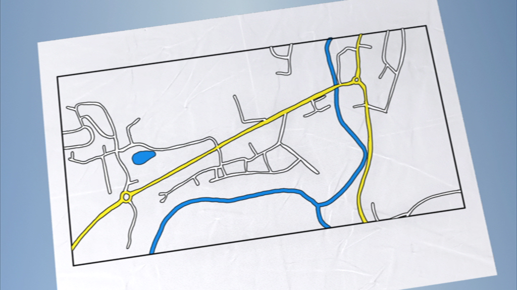Ein schematischer Stadtplan mit gelben und blauen Straßen, die sich durch eine graue Umgebung schlängeln.