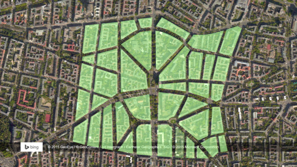 Luftaufnahme eines Stadtplans mit grün markierten Bereichen, die verschiedene Stadtviertel darstellen.
