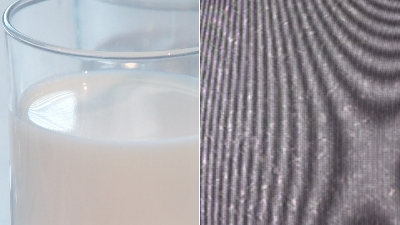 Ein Glas mit milchigem Getränk, daneben eine Nahaufnahme von gestreiftem Stoff.