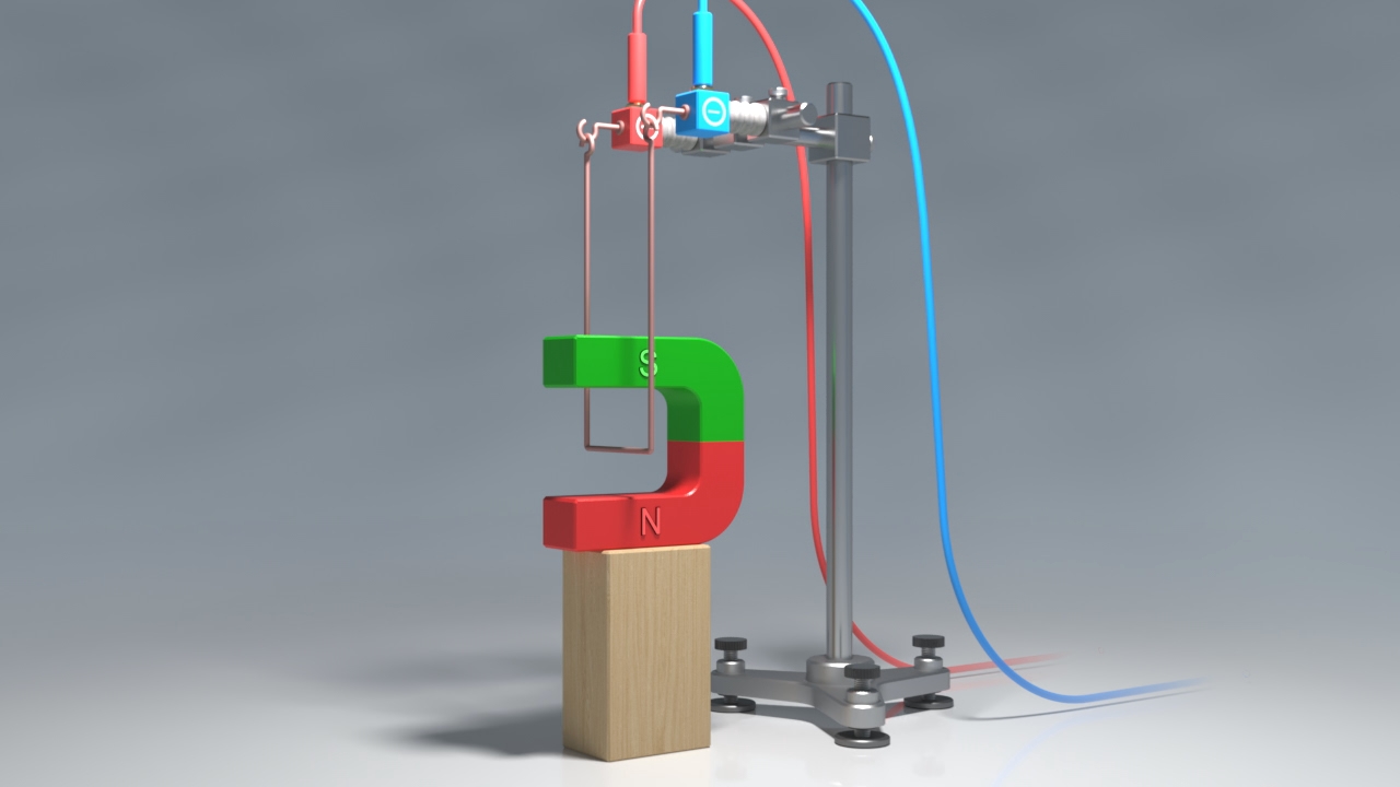 Ein mechanisches Gerät hebt einen großen, grünen und roten Magneten in Form eines Fragezeichens von einem Holzblock.