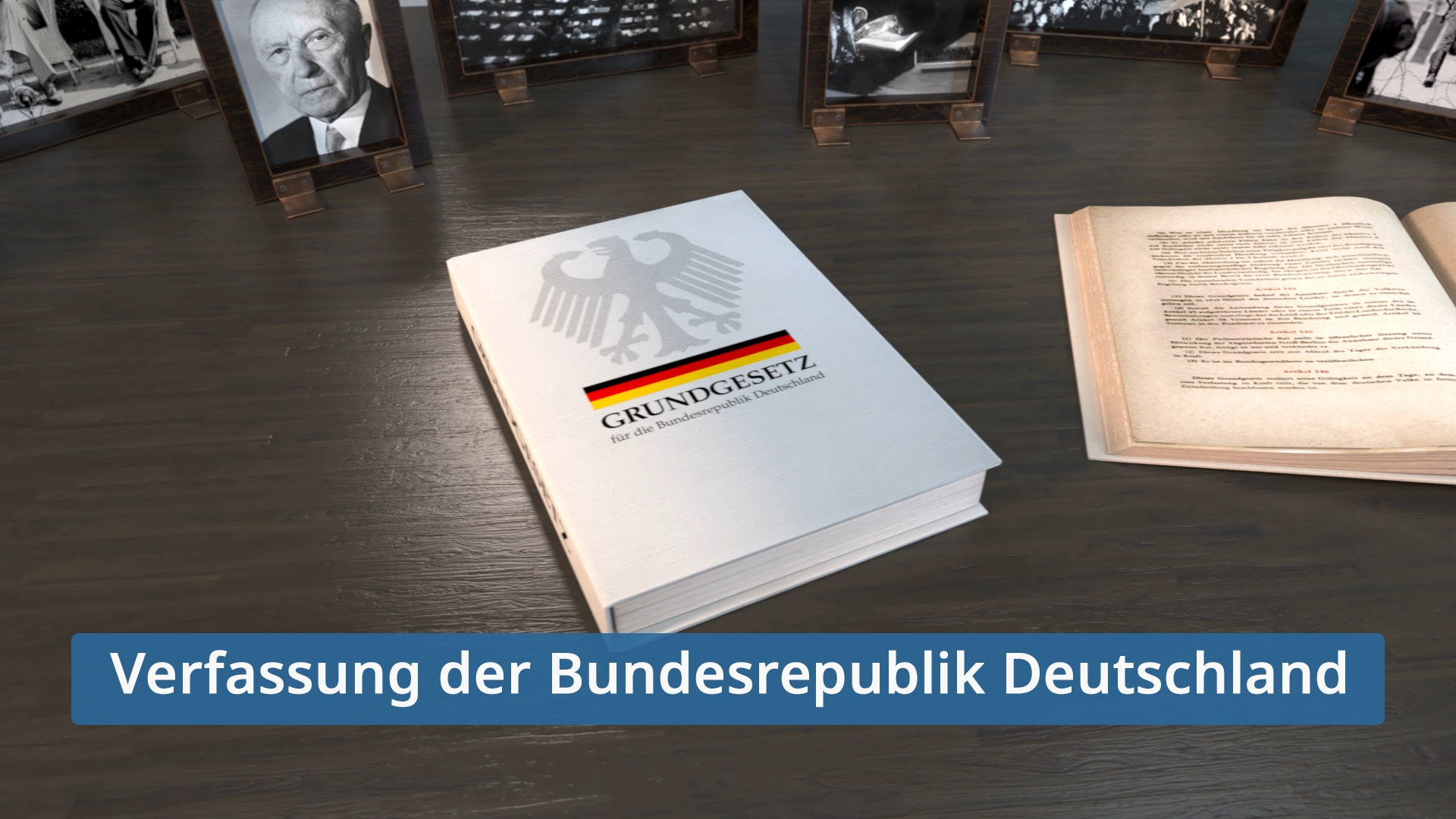 Das Grundgesetz für die Bundesrepublik Deutschland liegt auf einem Tisch, umgeben von historischen Fotos und einem geöffneten Buch mit Texten.