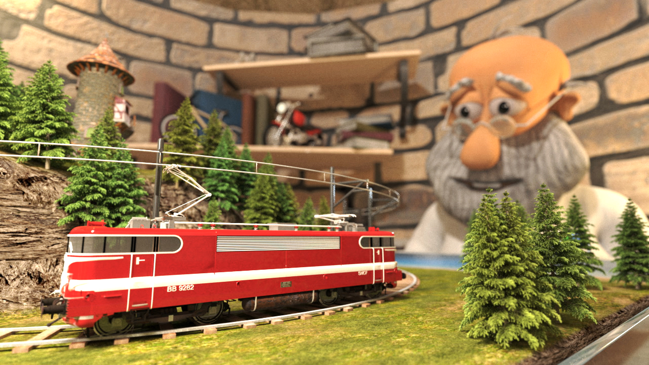 Ein roter Modellzug fährt auf einer kleinen Eisenbahnstrecke, während ein älterer Mann mit Brille und Bart im Hintergrund zuschaut.