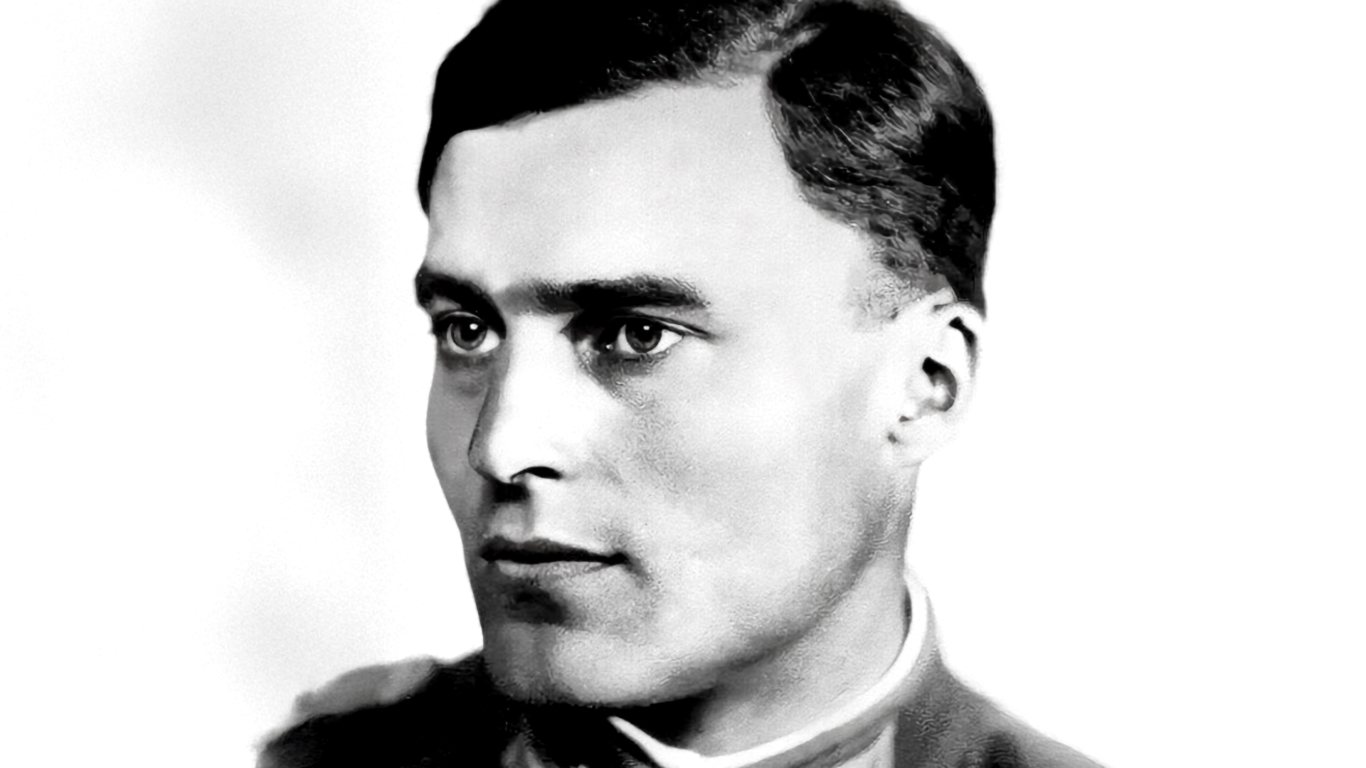 Porträt eines jungen Mannes mit kurzen, dunklen Haaren und einem ernsten Gesichtsausdruck, in militärischer Uniform.